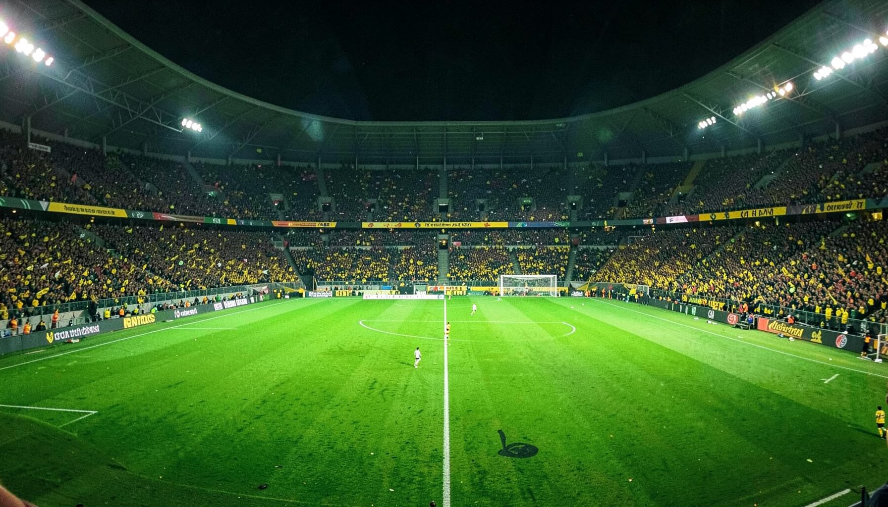 Floodlit football stadium packed with fans, vibrant green field under bright lights, energetic atmosphere in deep greens and golds